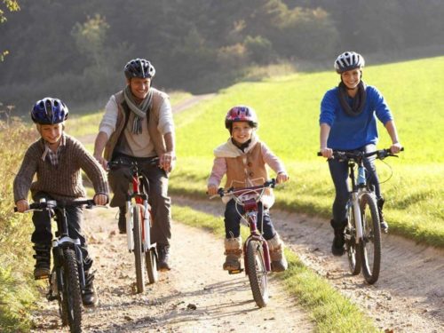Family riding bycicles for excersize together